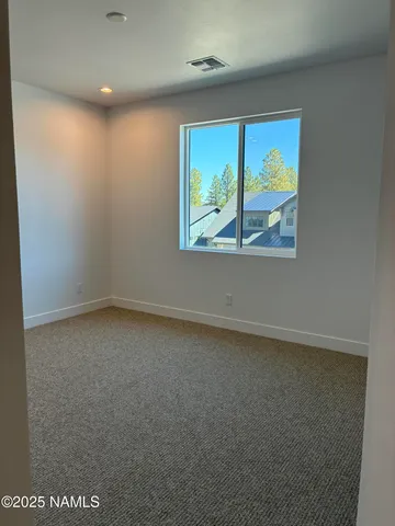 a view of a room with stairs and ventilation