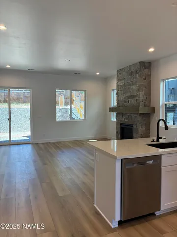 a open kitchen with cabinets stove and oven