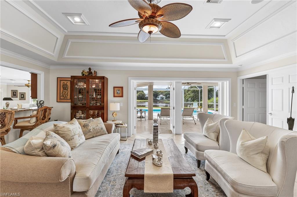 1904 Countess Court Naples, FL 34110 - Photo 4 of 33 a living room with furniture and a large window