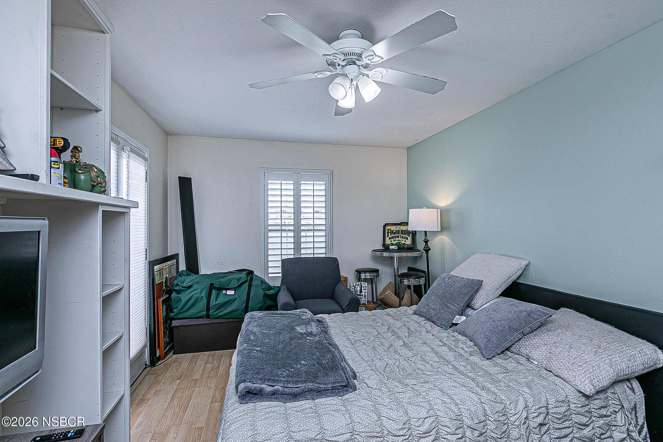 712 Pebble Beach Place Santa Maria, CA 93454 - Photo 16 of 31 a bedroom with a bed window and couch