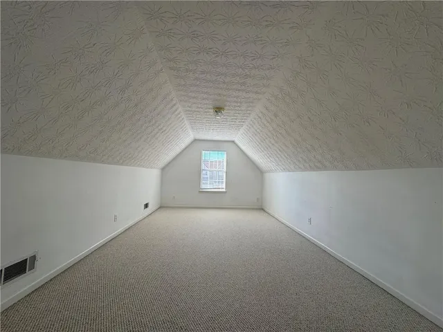 a view of a big room with a window