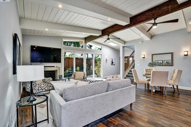 a view of a hallway with wooden floor and entryway