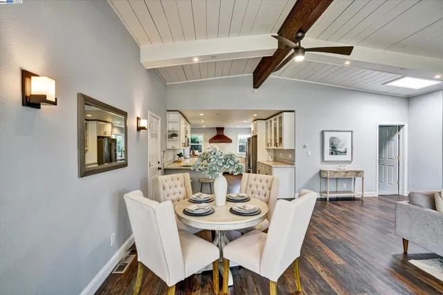 a bedroom with a bed and a potted plant
