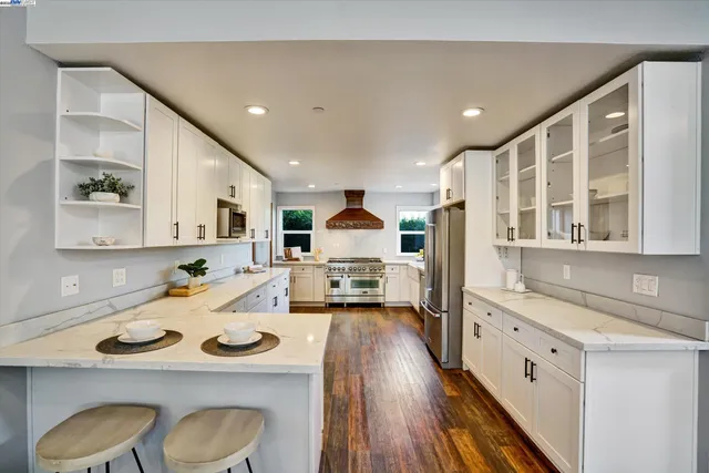 a view of a livingroom with furniture and staircase