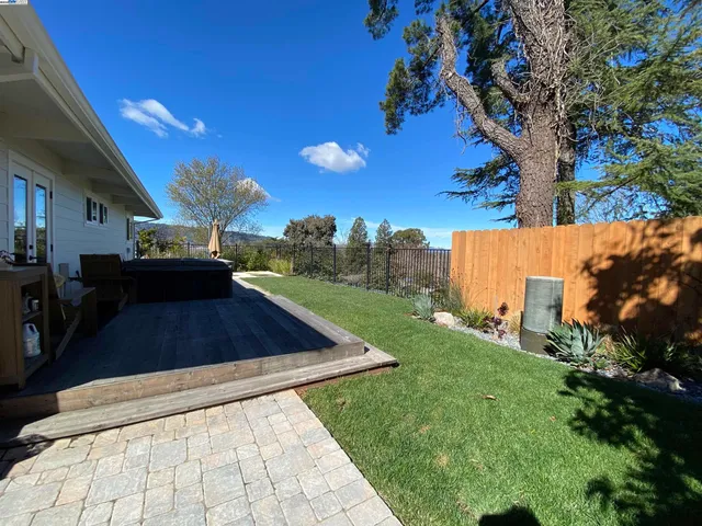 a dining room with furniture wooden floor a rug and a painting
