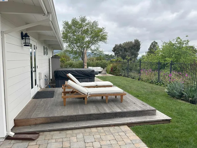 a kitchen with a stove and a white wooden cabinets