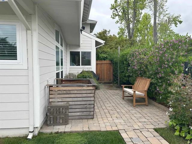 a kitchen with stainless steel appliances a refrigerator stove and wooden floor