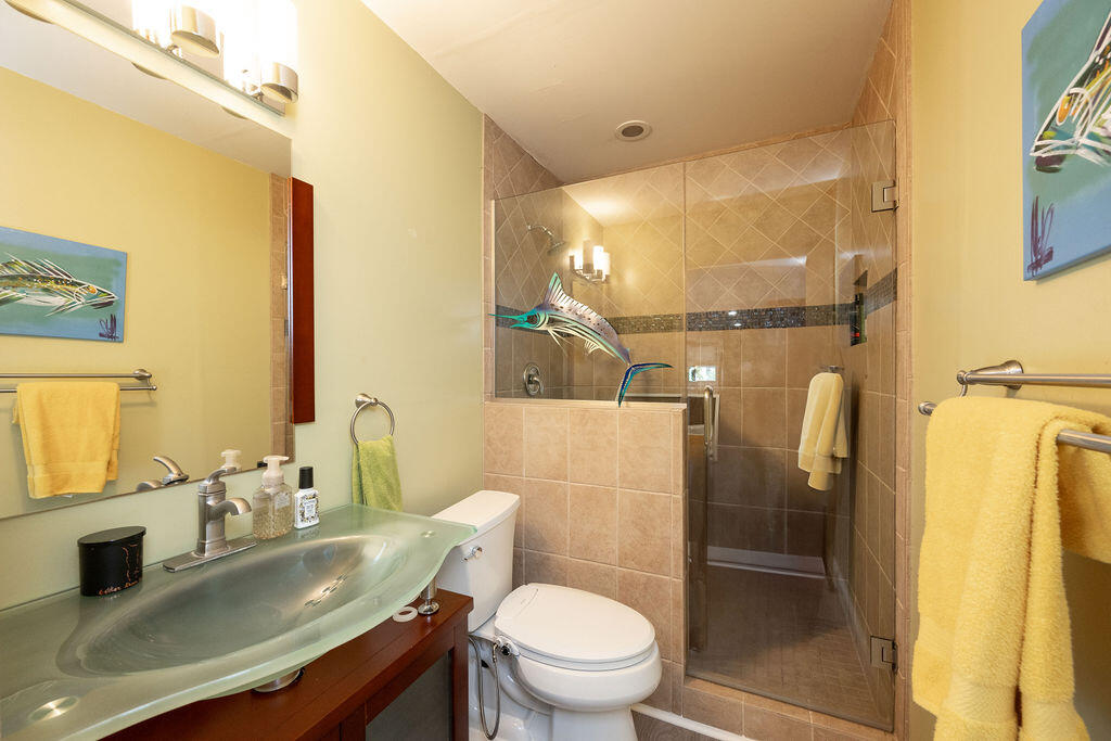 3246 Duck Avenue Key West, FL 33040 - Photo 19 of 21 a bathroom with a sink a toilet and a mirror