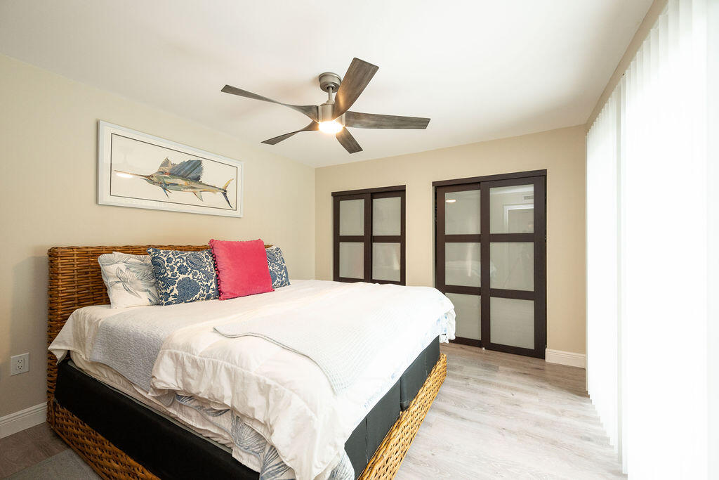 3246 Duck Avenue Key West, FL 33040 - Photo 20 of 21 a bedroom with a large bed and a large window