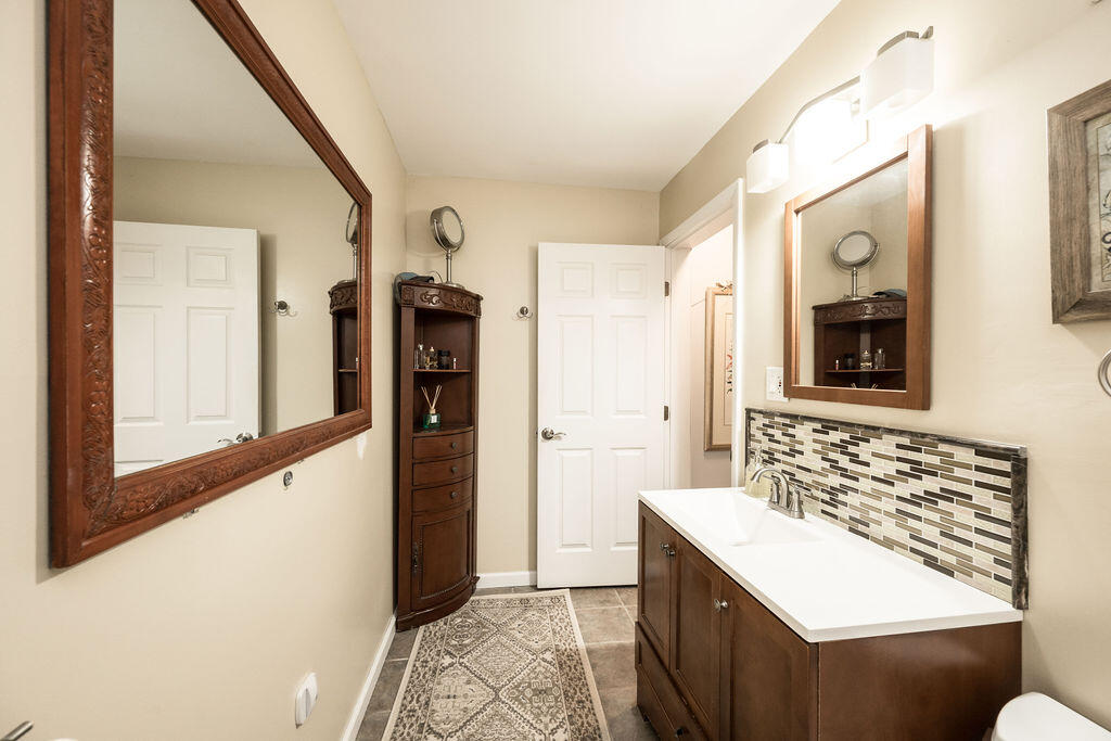 3246 Duck Avenue Key West, FL 33040 - Photo 3 of 21 a bathroom with a sink and a mirror