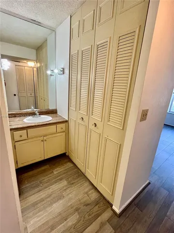 a view of a hallway with washer and dryer