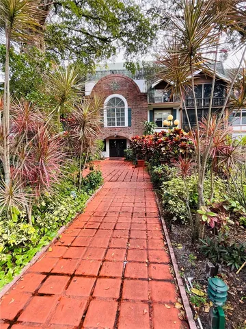 an outdoor space with furniture and umbrella