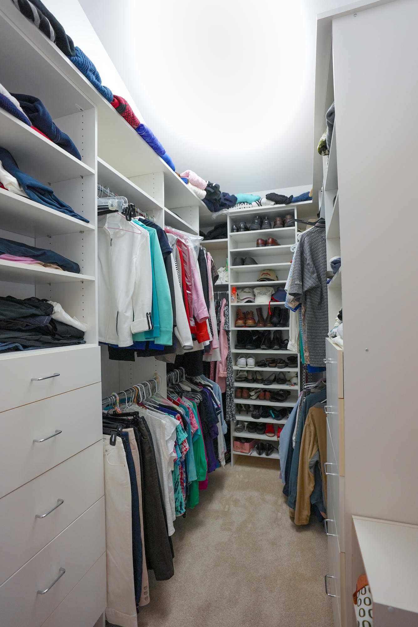60709 Golf Village Loop Bend, OR 97702 - Photo 27 of 45 Walk in master closet with built in dressers and shoe rack shelves