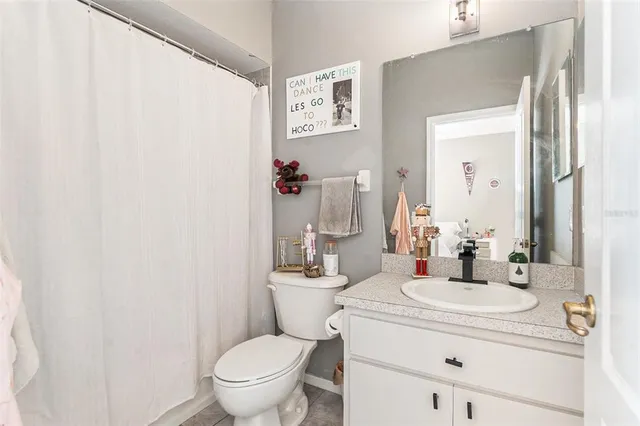 a bedroom with furniture and a wooden floor