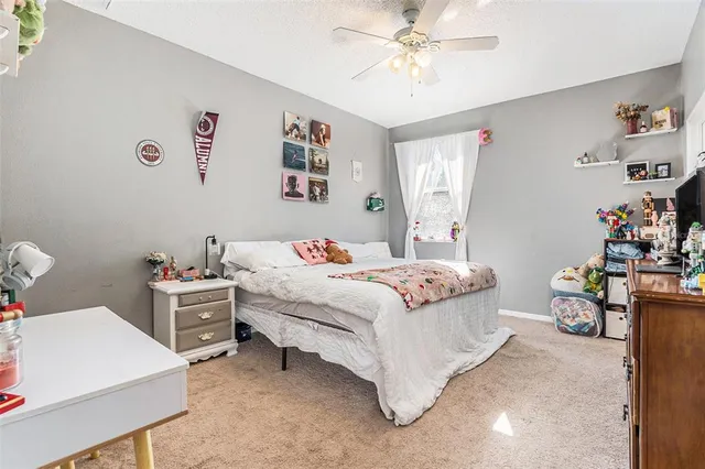 a bathroom with a sink a toilet a mirror a bathtub and shower