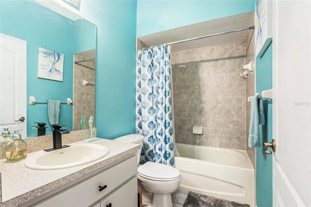 a view of a patio with iron fence