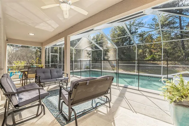 a view of a backyard with a swimming pool