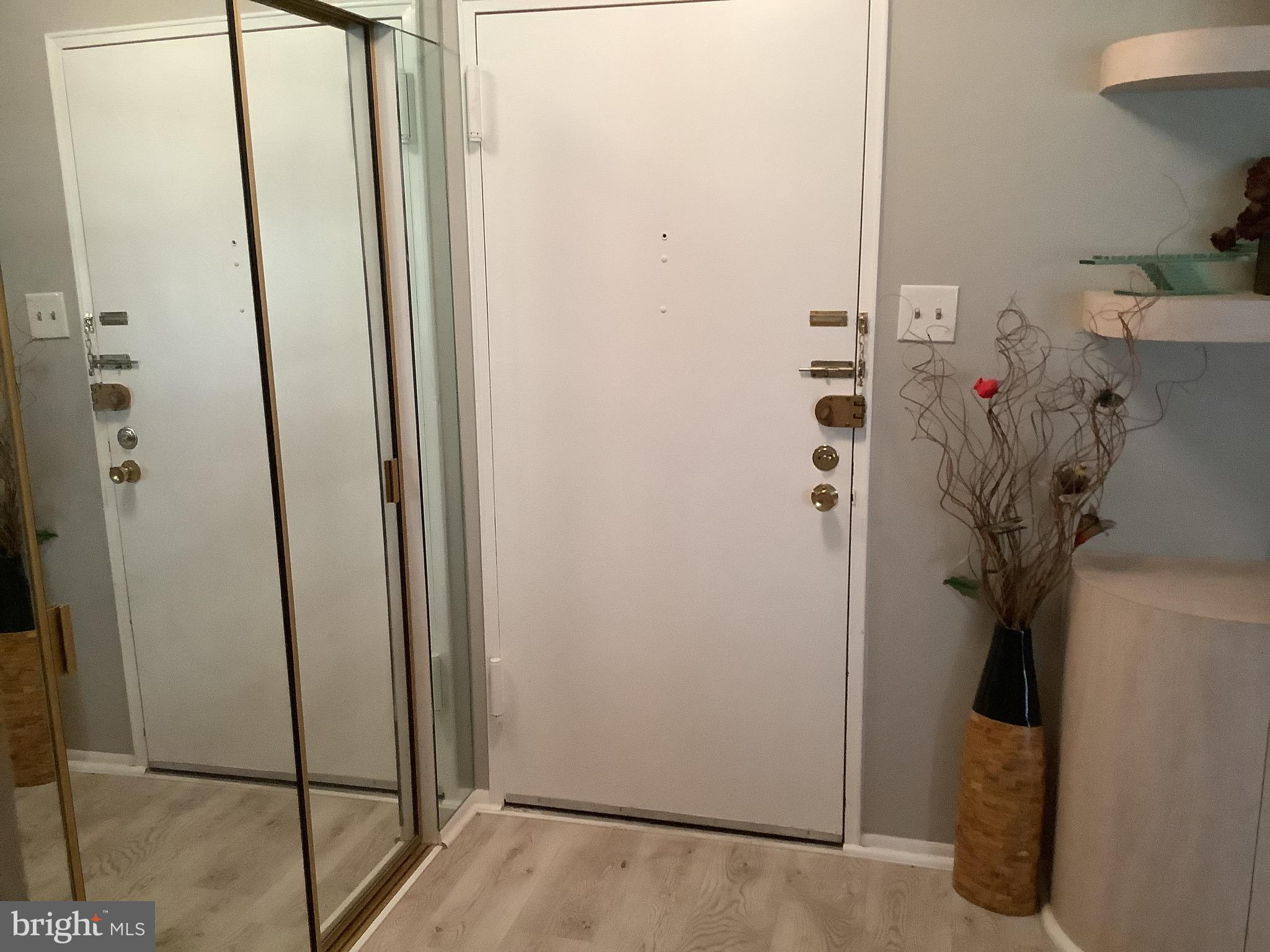 8940 Krewstown Road, Unit 105 Philadelphia, PA 19115 - Photo 4 of 24 Foyer area with coat coset