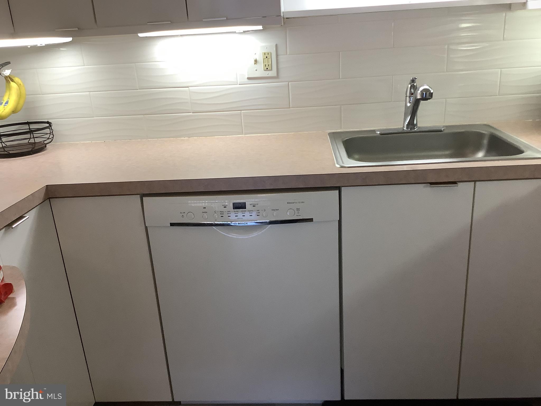 8940 Krewstown Road, Unit 105 Philadelphia, PA 19115 - Photo 8 of 24 Stylish backsplash and Bosch dishwasher