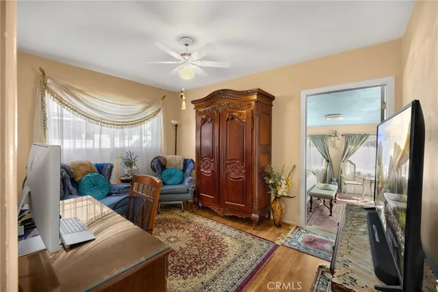 a bedroom with a bed a table and chair