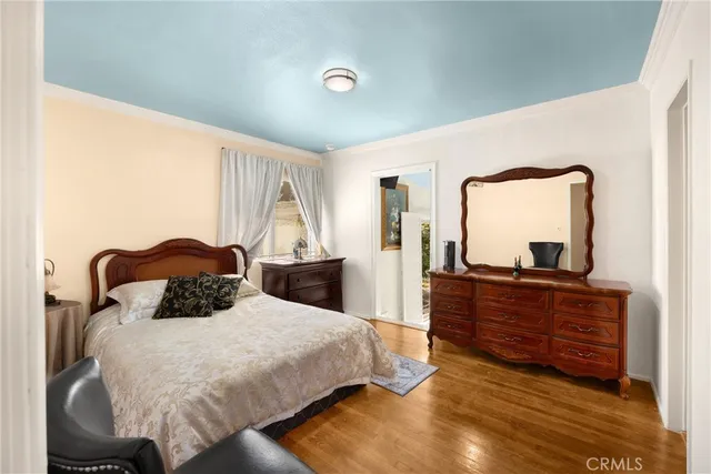 a bedroom with a bed and a chair