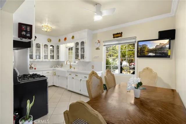 a kitchen with cabinets and window