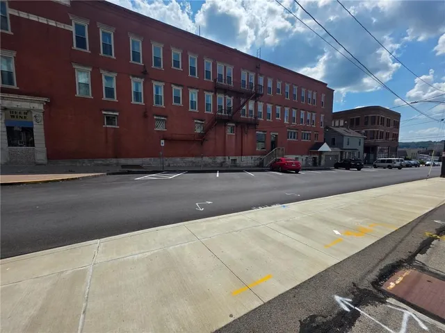 a view of a street with cars