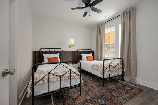 a bedroom with bed and window
