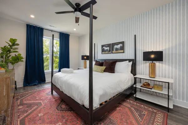 a bed room with a bed and a tv