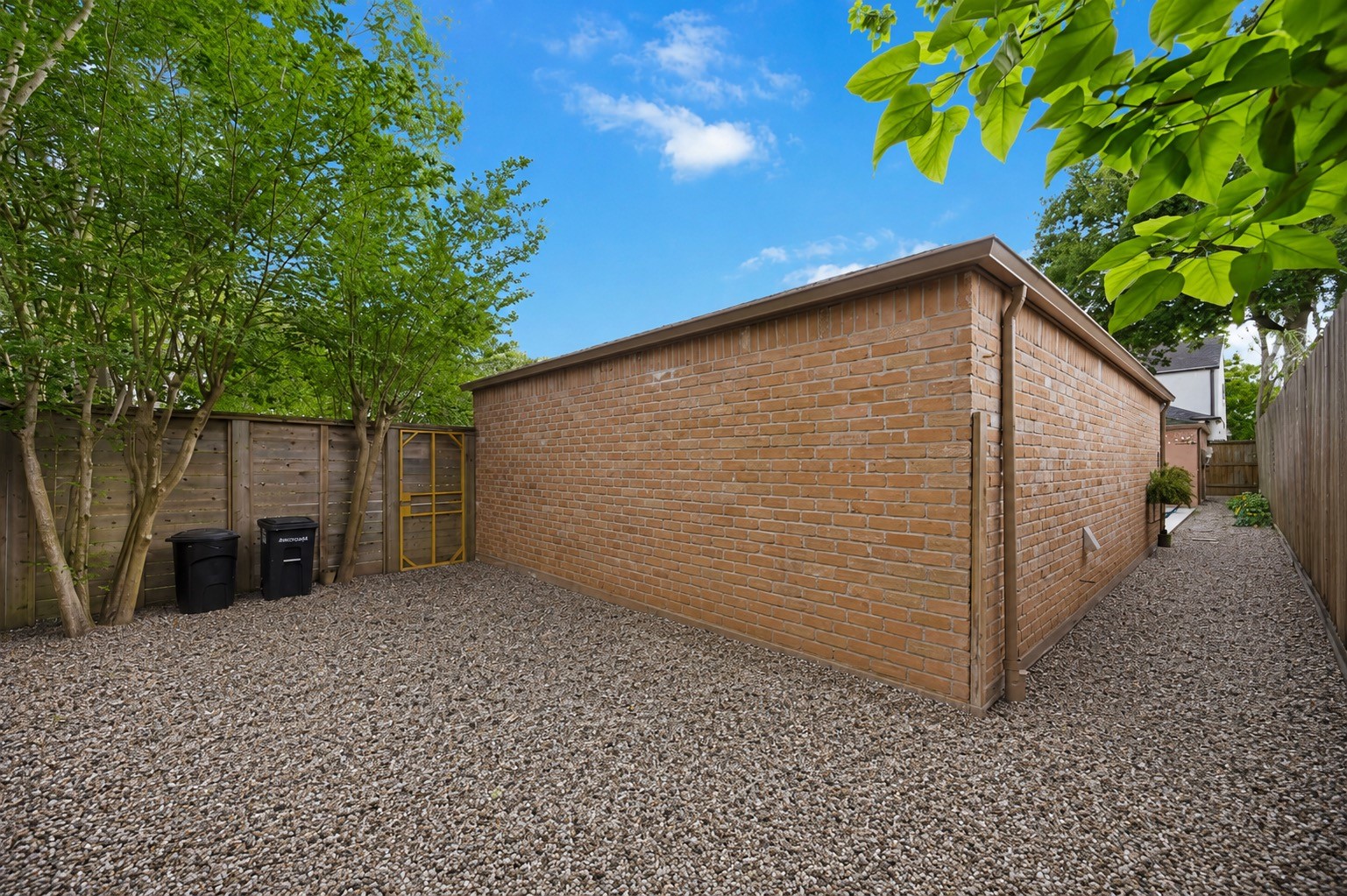 619 Rancho Bauer Drive Houston, TX 77079 - Photo 41 of 46 A courtyard by the garage can be a perfect space for a cozy sitting area, outdoor entertaining, or even a playground for kids.