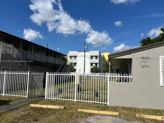 a view of a house with a fence