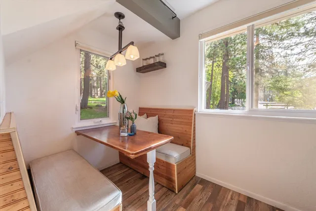 a view of a dining room with furniture window and wooden floor