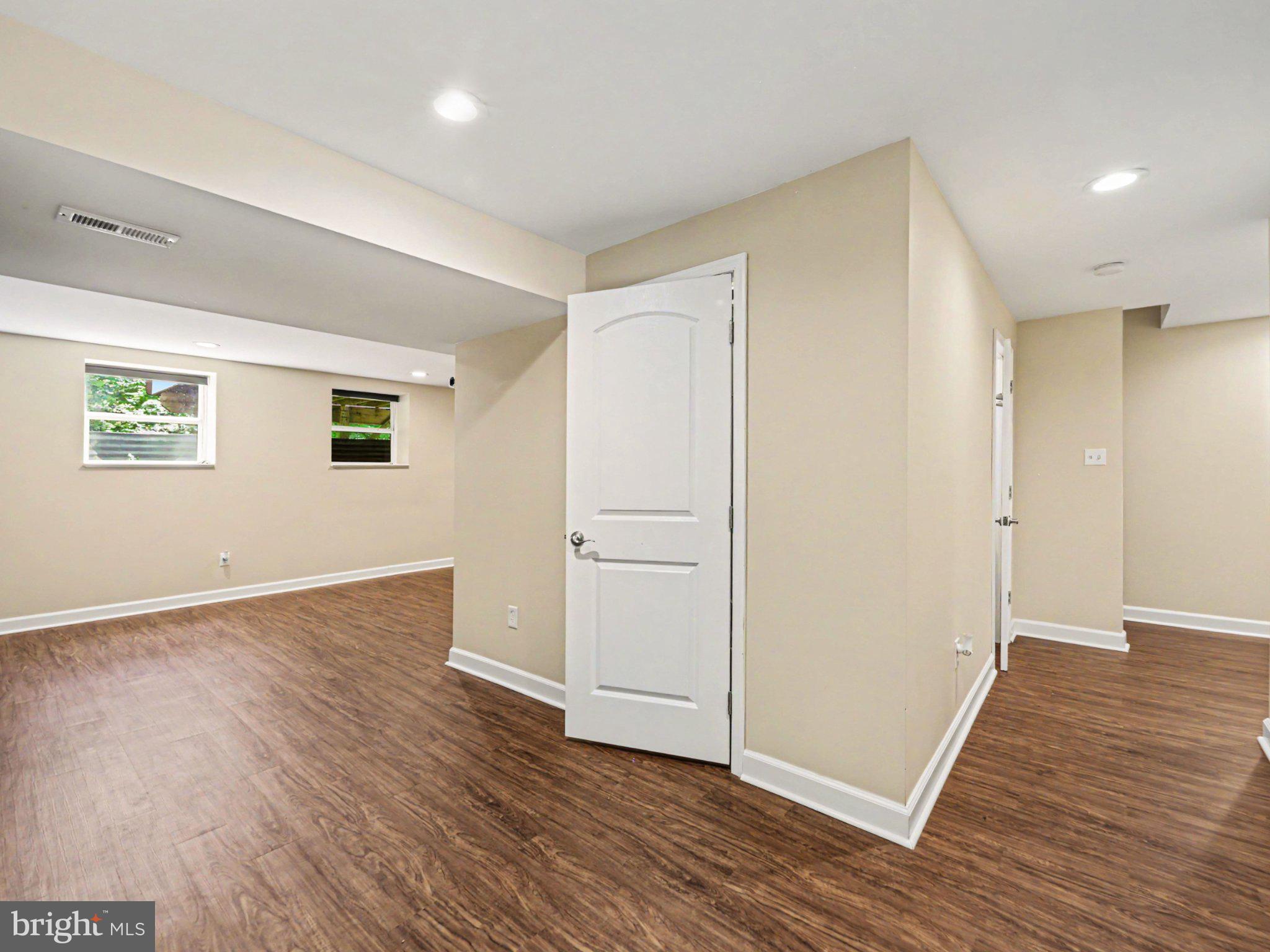 9811 Catharpin Road Spotsylvania, VA 22551 - Photo 14 of 30 an empty room with wooden floor and white doors