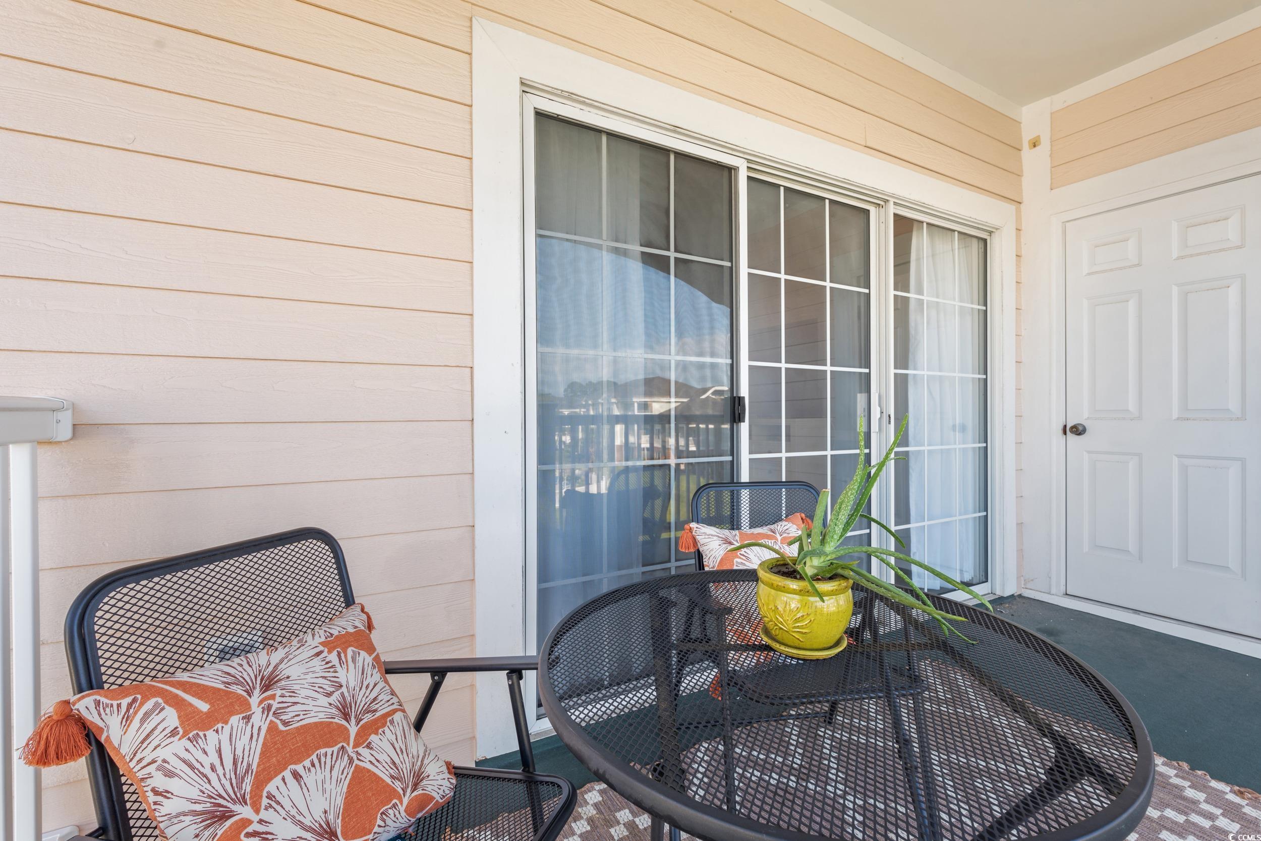4864 Carnation Circle, Unit 304 Myrtle Beach, SC 29577 - Photo 10 of 36 Balcony featuring outdoor dining space