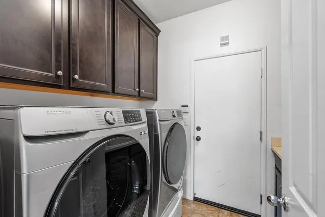 a bedroom with a bed and a ceiling fan