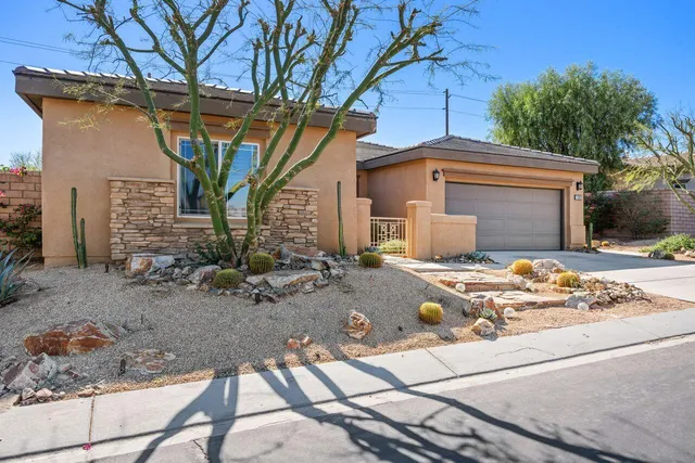a front view of a house with garage