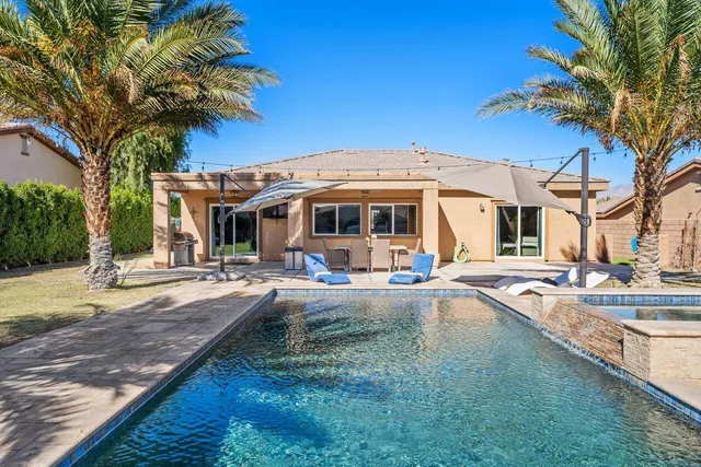 a view of outdoor space with swimming pool and patio