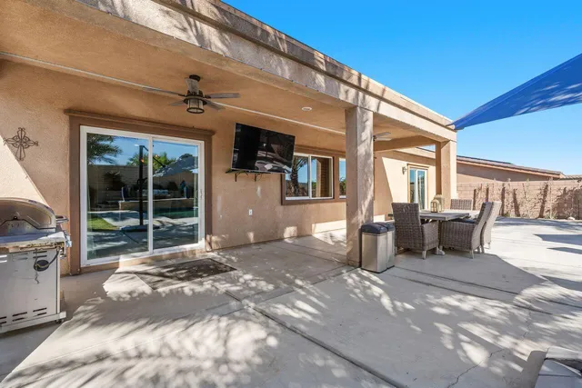 a view of yard with patio