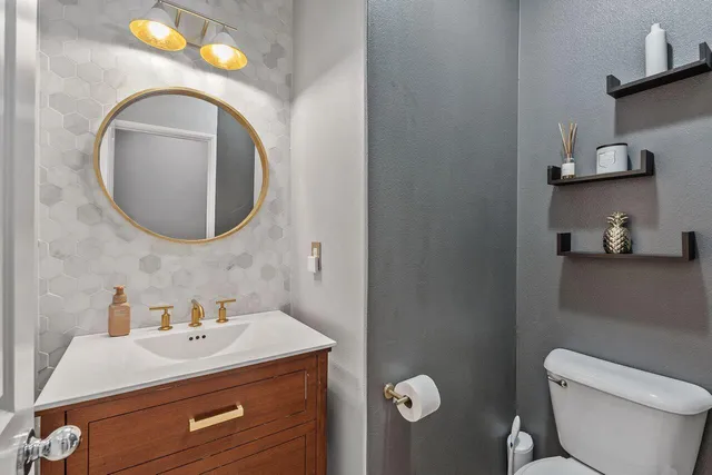 a kitchen with kitchen island a stove a table and chairs