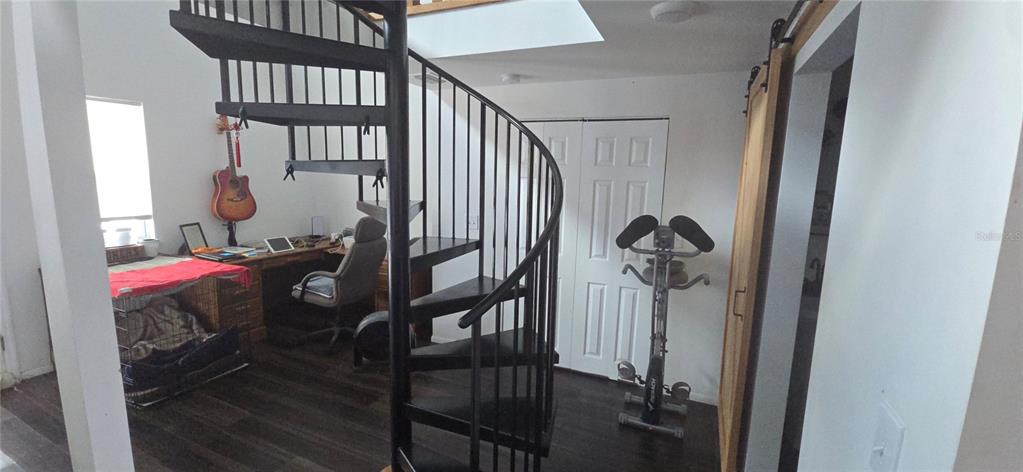 206 Lake Ida Road Frostproof, FL 33843 - Photo 18 of 46 a view of a hallway with wooden floor and entryway