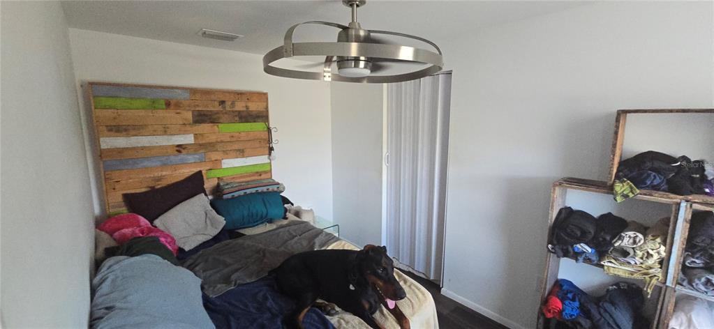 206 Lake Ida Road Frostproof, FL 33843 - Photo 22 of 46 a living room with furniture and a chandelier