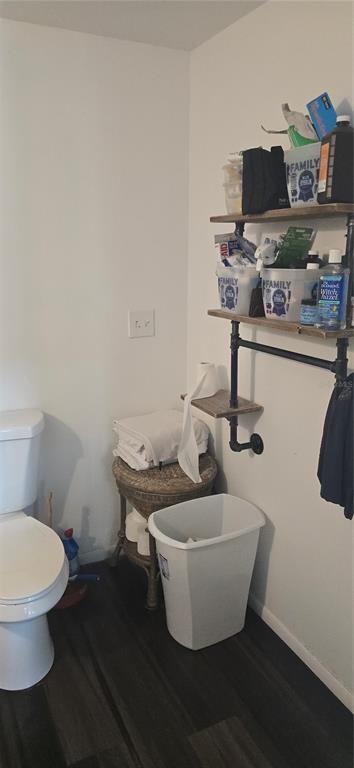 206 Lake Ida Road Frostproof, FL 33843 - Photo 25 of 46 a white toilet sitting next to a bathroom sink