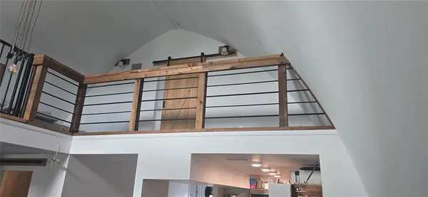 a view of balcony with furniture
