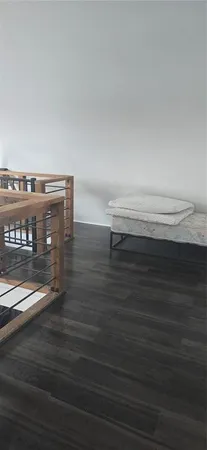 a view of entryway and wooden floor