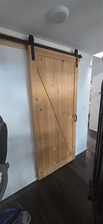a view of room with wooden floor