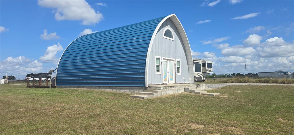 206 Lake Ida Road Frostproof, FL 33843 - Photo 6 of 46 a view of a house with a yard