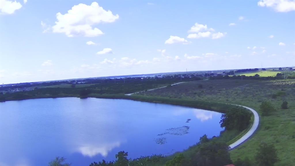 206 Lake Ida Road Frostproof, FL 33843 - Photo 10 of 46 a view of a lake in middle of forest