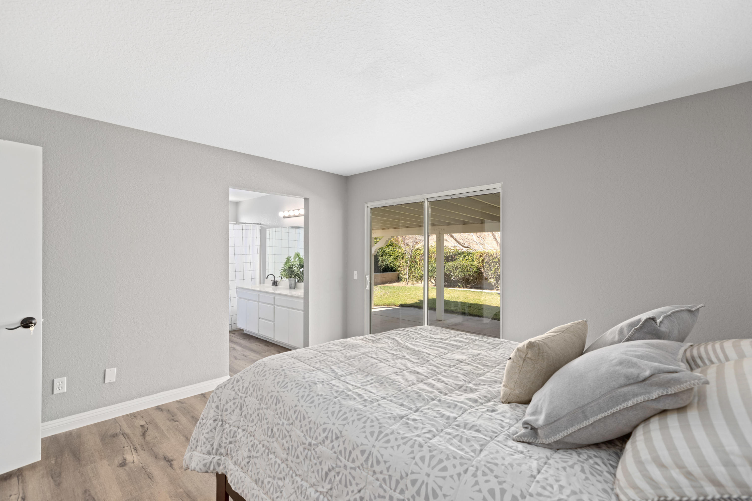 40325 Argyle Lane Palmdale, CA 93551 - Photo 11 of 24 a bedroom with a bed and a window