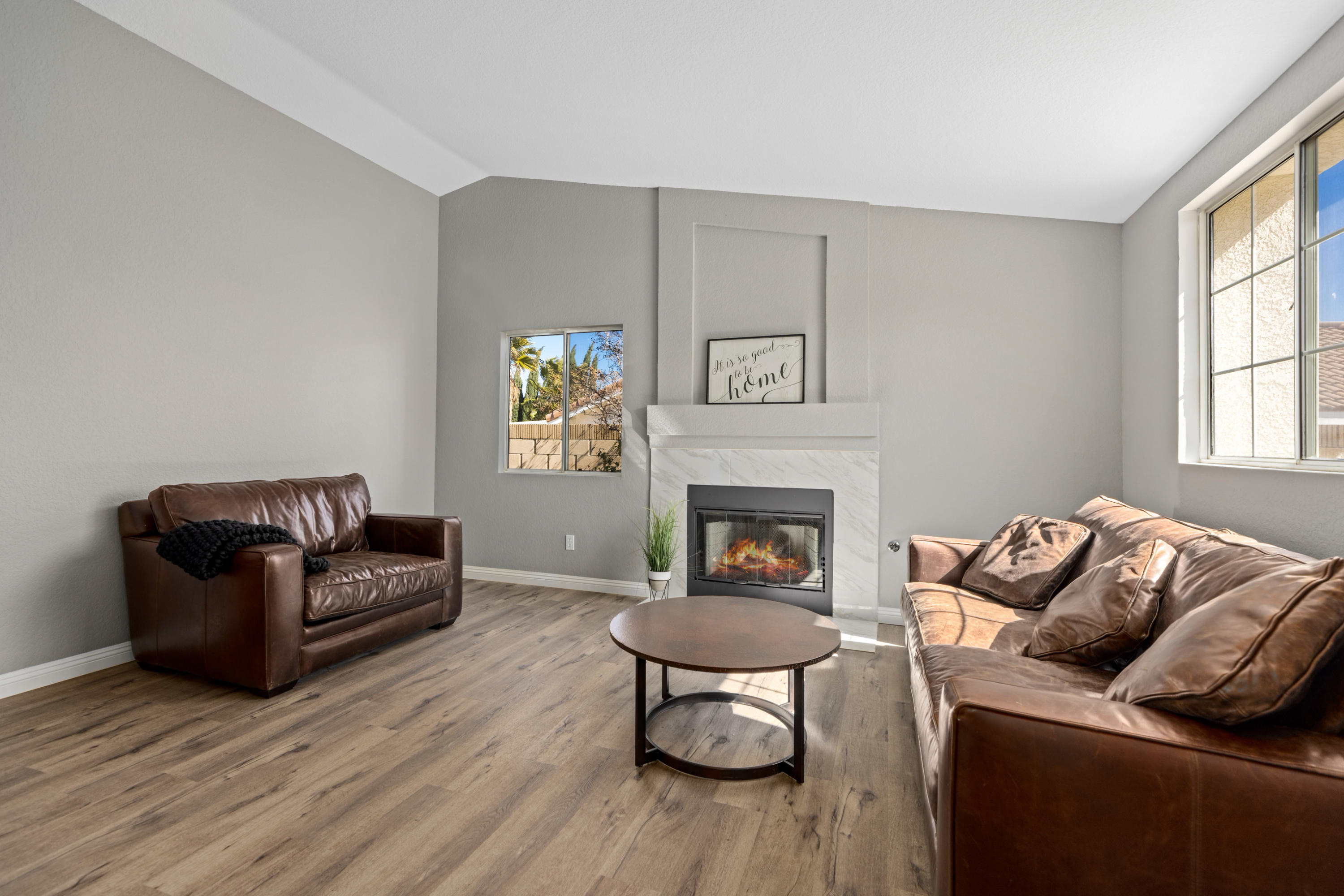 40325 Argyle Lane Palmdale, CA 93551 - Photo 3 of 24 a living room with furniture and a fireplace
