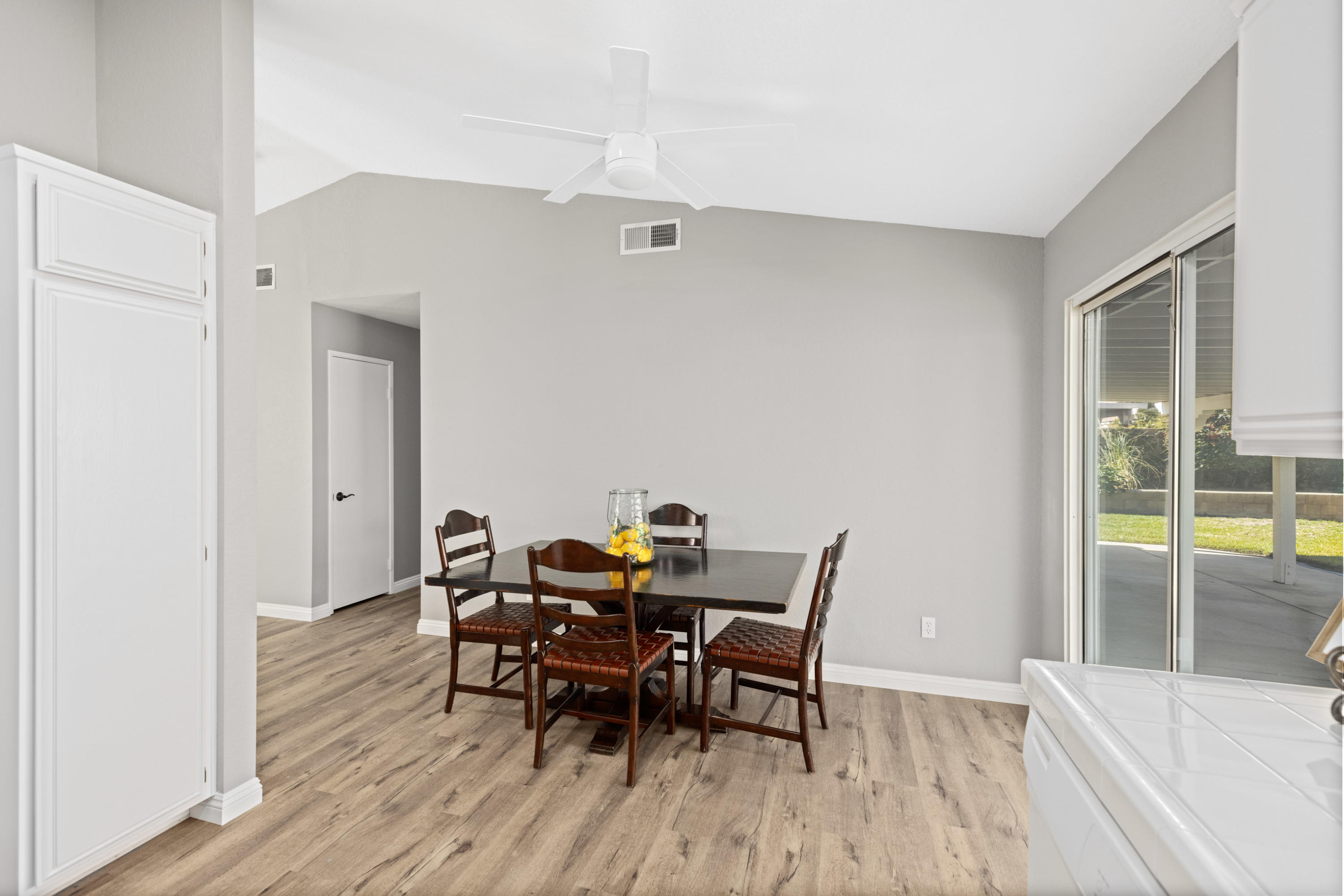 40325 Argyle Lane Palmdale, CA 93551 - Photo 9 of 24 a view of a dining room with furniture and wooden floor